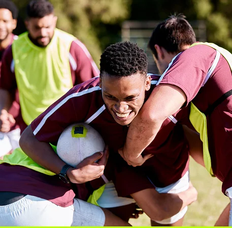 A moment from a rugby match where players struggle